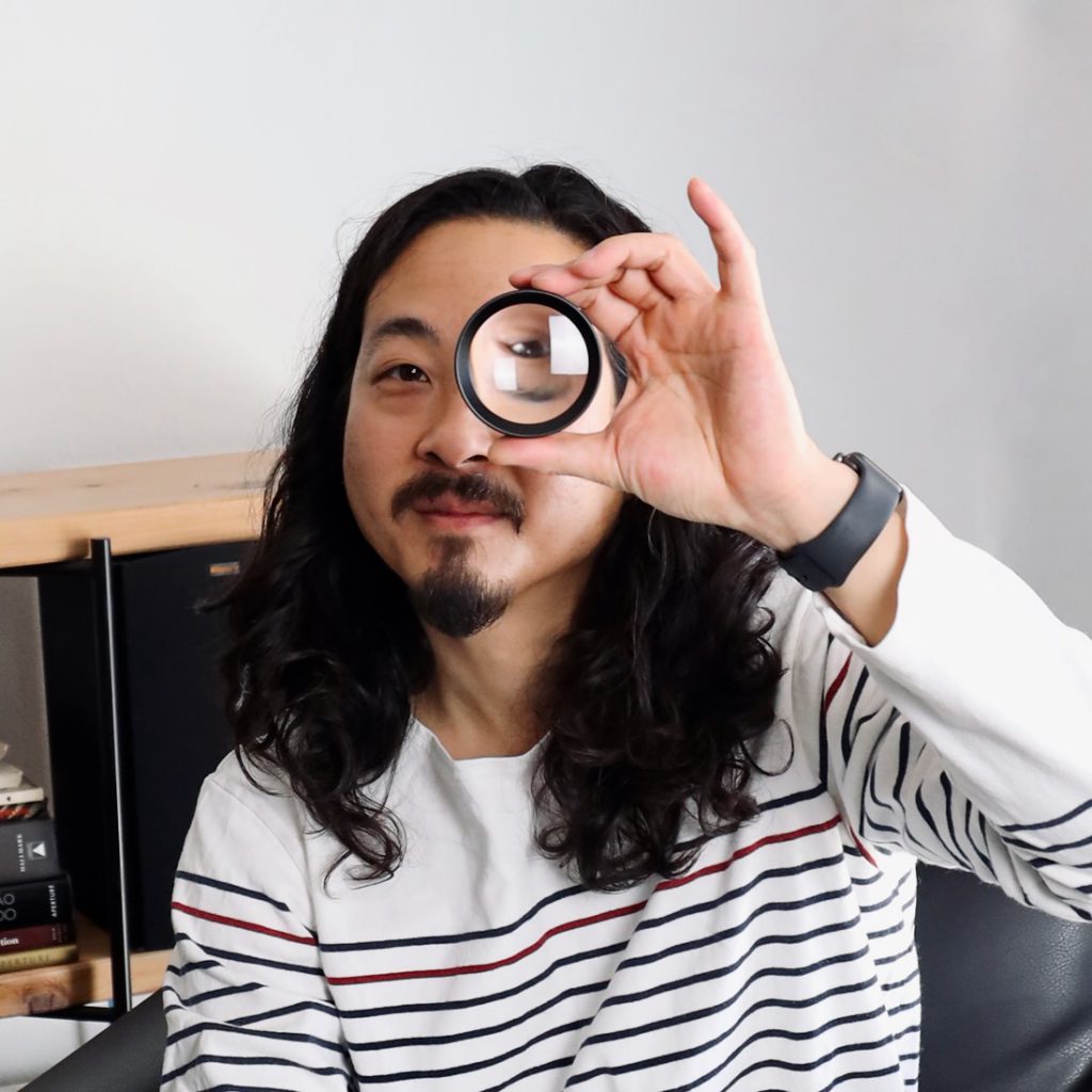 Tyler Lau with magnifying glass