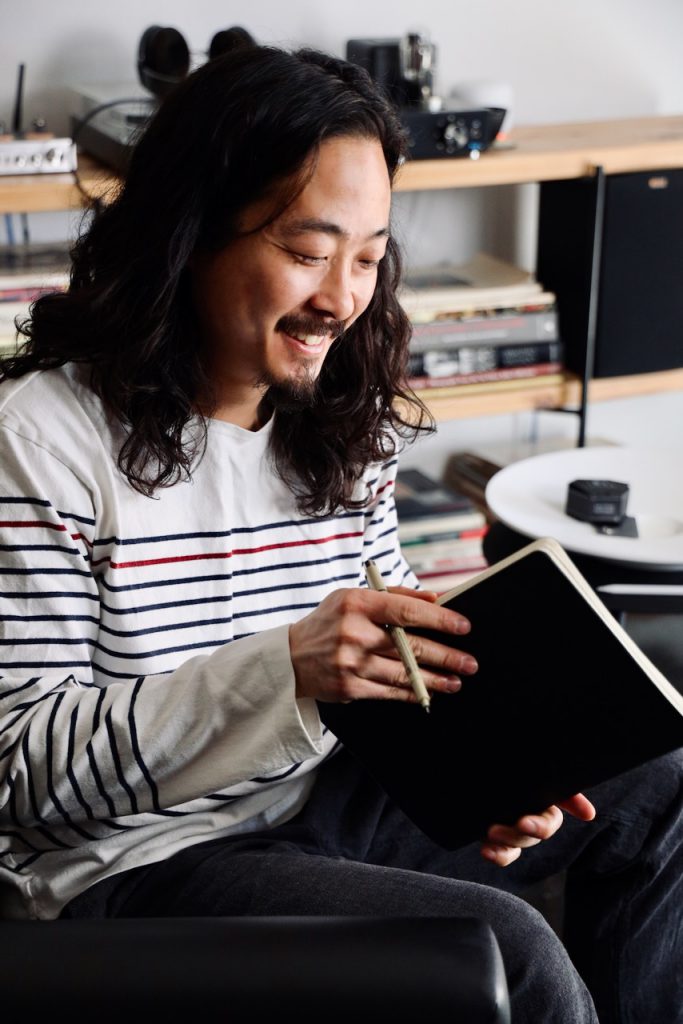 Tyler Lau with notebook